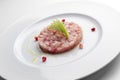 Fish dish, amberjack tartare with mustard jam and pomegranate gr