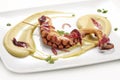 Fish dish, braised octopus on chickpea cream with caramelized on