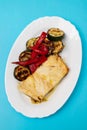 Fish dish - fried cod fish with grilled vegetables in plate Royalty Free Stock Photo