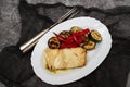 Fish dish - fried cod fish with grilled vegetables in plate Royalty Free Stock Photo