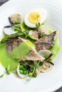 Fish dish - fried fish fillet of zander served with mussels, peas, asparagus and vegetable cream sauce. Restaurant menu, dieting, Royalty Free Stock Photo