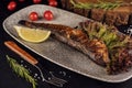 Fish dish - grilled herrings with cherry tomatoes Royalty Free Stock Photo