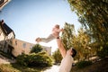 Fish-eye photo father playing with daughter tossing her up