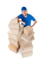 Fish eye shot of smiling courier with stack of cardboard boxes Royalty Free Stock Photo