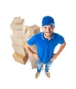 Fish eye shot of smiling courier with stack of cardboard boxes Royalty Free Stock Photo