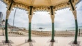 Fish eye view of the Victorian bandstand and the remains of the destroyed West pier in Brighton and Hove Royalty Free Stock Photo