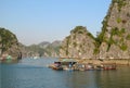 Fish farm between rock island in the sea Royalty Free Stock Photo