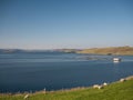 Fish farming on calm waters near Hamnavoe on the west of Mainland, Shetland, Scotland, UK - taken on a sunny day in August