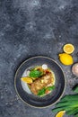 fish fillet breaded in nuts with pepper sauce and vegetables, vertical image. top view. place for text Royalty Free Stock Photo