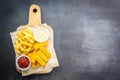 Fish finger and french fries or chips with tomato ketchup and mayonnaise sauce Royalty Free Stock Photo