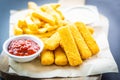 Fish finger and french fries or chips with tomato ketchup and mayonnaise sauce Royalty Free Stock Photo