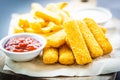 Fish finger and french fries or chips with tomato ketchup and mayonnaise sauce Royalty Free Stock Photo