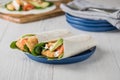 Fish finger wraps with avocado and tomato