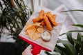 Fish fingers with crispy nachos along with tartar sauce