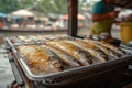 Fish are fried in oil at the floating market.