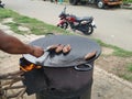 Fish Frying in a Tawa on Road Side of the Bangalore at Evening Time