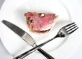 Fish head with crossed cutlery Royalty Free Stock Photo