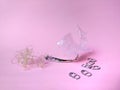 Fish hook with marine litter on pink background. plastic bag. pollution concept