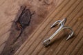 Fish Hook on a wooden background Royalty Free Stock Photo