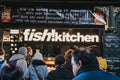 Fish Kitchen stall in Borough Market, London, UK, people queue at front, selective focus Royalty Free Stock Photo