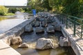 Fish ladder, fishway, fish pass or fish steps passage though weir crossing on  river Royalty Free Stock Photo