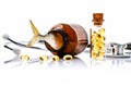 Fish liver oil capsules in bottle with stethoscope isolate on white background. Royalty Free Stock Photo