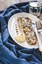 Fish mackerel baked with herbs, mashed potatoes, pesto sauce served on a white plate on a wooden antique background, next to a bl Royalty Free Stock Photo