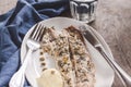 Fish mackerel baked with herbs, mashed potatoes, pesto sauce served on a white plate on a wooden antique background, next to a bl Royalty Free Stock Photo