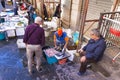 Local people and tourists buying fresh fish on a fish market