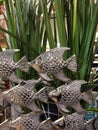 Fish Metal panel decor. Decorative silver shoal of fish