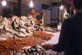 Fish monger at Catania market, Sicily, Italy