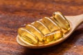 Fish oil capsule in the spoon is nutrition food for healthy. Royalty Free Stock Photo