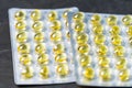 Fish oil capsules in blister pack. Place for your text. Royalty Free Stock Photo