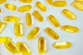 Fish oil capsules pills heap. Medicine background