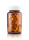 Fish oil dietary supplement capsules in brown glass bottle Royalty Free Stock Photo