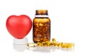 Fish oil gel capsule with bottle and heart shaped prop. It containing omega-3 polyunsaturated acid EPA and DHA enhances heart and