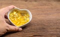 Fish oil in heart shape bowl Royalty Free Stock Photo