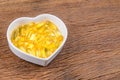 fish oil in heart shape bowl Royalty Free Stock Photo