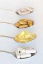 Fish oil and other healthy supplements on a teaspoon Royalty Free Stock Photo