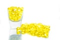 Fish oil, soft capsule, omega, supplement in glass isolated on w