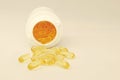 Fish Oil Tablets Pouring out of Bottle Royalty Free Stock Photo