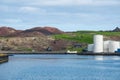 Fish oil tanks and historic buildings in Vestmannaeyjar Iceland