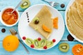 Fish pancakes with fruits and berries Royalty Free Stock Photo