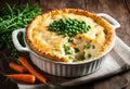 A fish pie with mashed potatoes, cheese, peas, and carrots Royalty Free Stock Photo