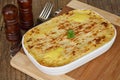 Fish pie on wooden table Royalty Free Stock Photo
