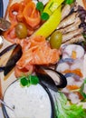 Fish platter with sliced salmon, mussels, smoked sprats, salted herring close-up. Royalty Free Stock Photo