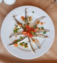 Fish raw on a plate , mackerel with parley tomatoes Royalty Free Stock Photo