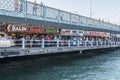 Fish restaurants on the Galata Bridge street cafe in Istambul