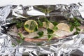 Fish river trout on a foil with spices ready for baking Royalty Free Stock Photo