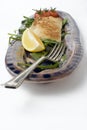 Fish and salad on earthenware platter